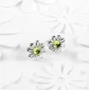 Daisy Stud Earrings in Silver and Peridot sold by Henryka