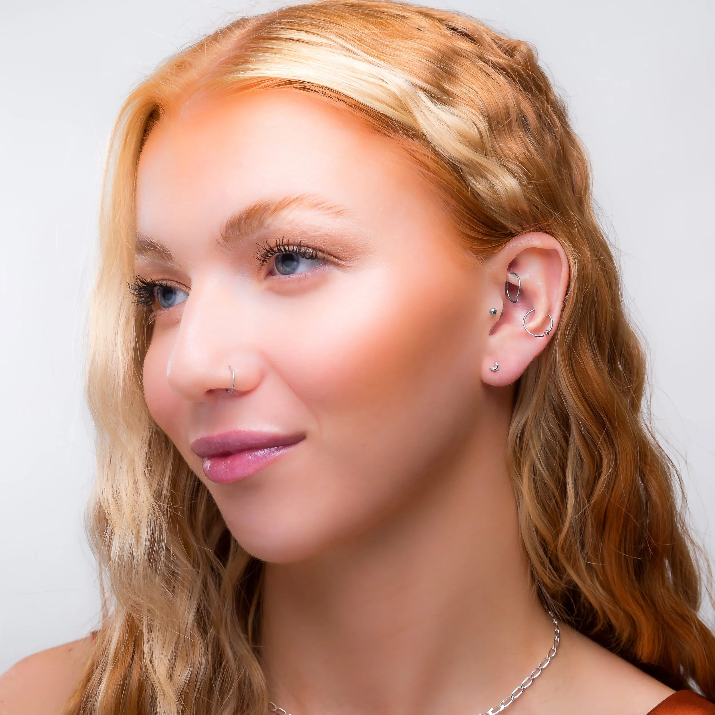 Tiny Double Leaf Stud Earrings in Silver sold by Henryka product image thumbnail 3