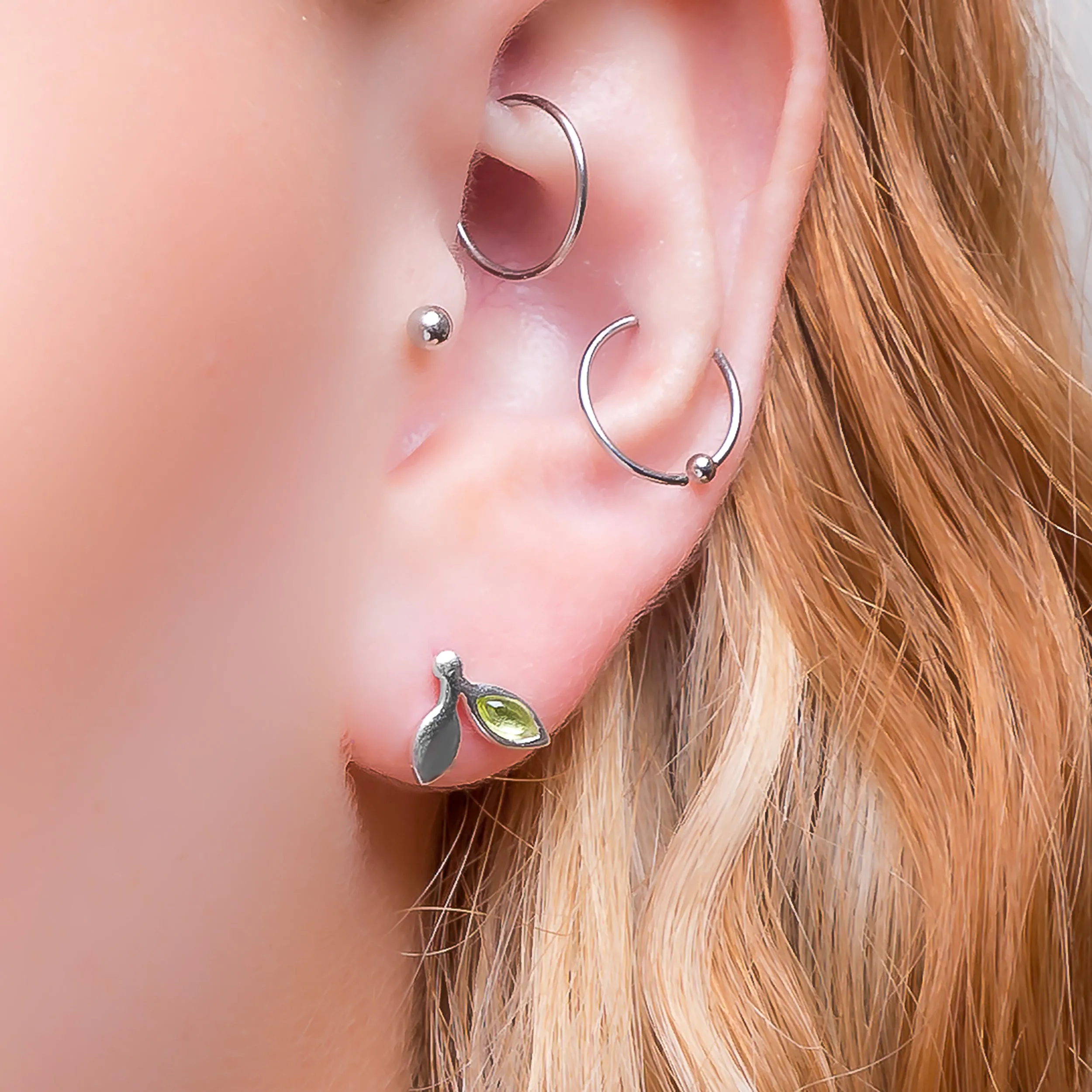 Tiny Leaf Stud Earrings in Silver & Peridot sold by Henryka product image thumbnail 2