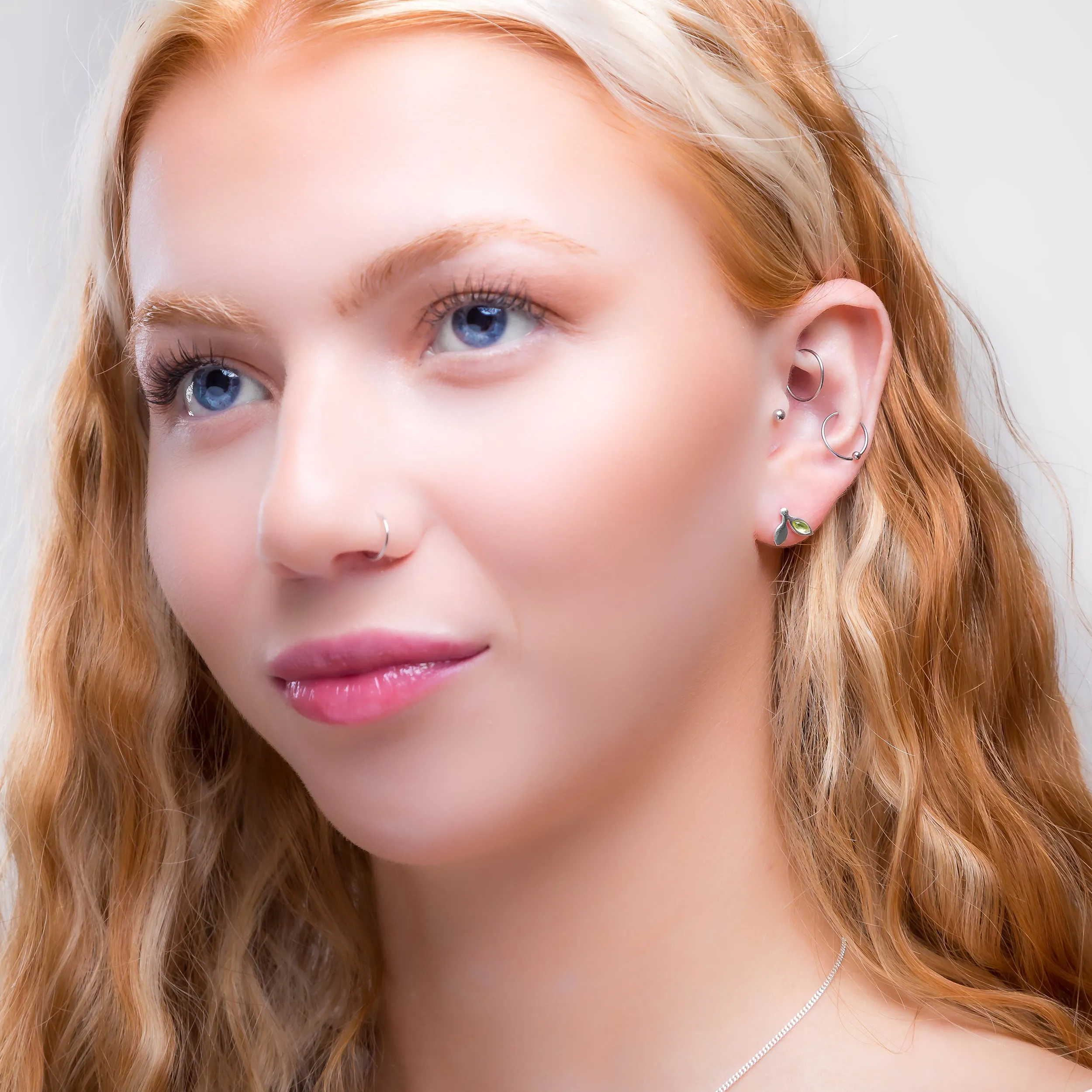 Tiny Leaf Stud Earrings in Silver & Peridot sold by Henryka product image thumbnail 3