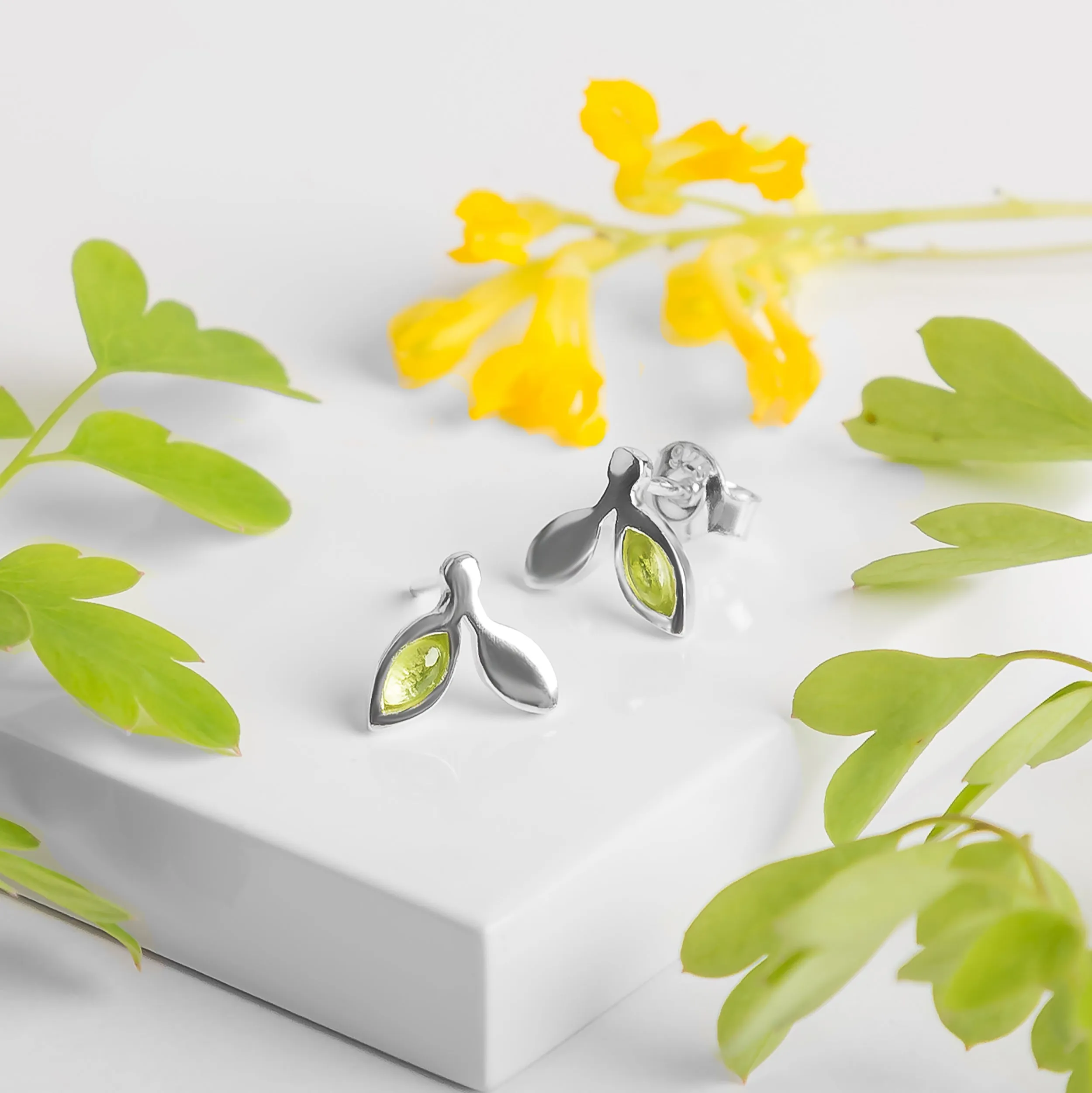 Tiny Leaf Stud Earrings in Silver & Peridot sold by Henryka product image thumbnail 4
