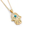 Hamsa Hand Necklace in Silver with 24ct Gold & Turquoise sold by Henryka