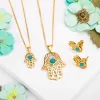 Hamsa Hand Necklace in Silver with 24ct Gold & Turquoise sold by Henryka