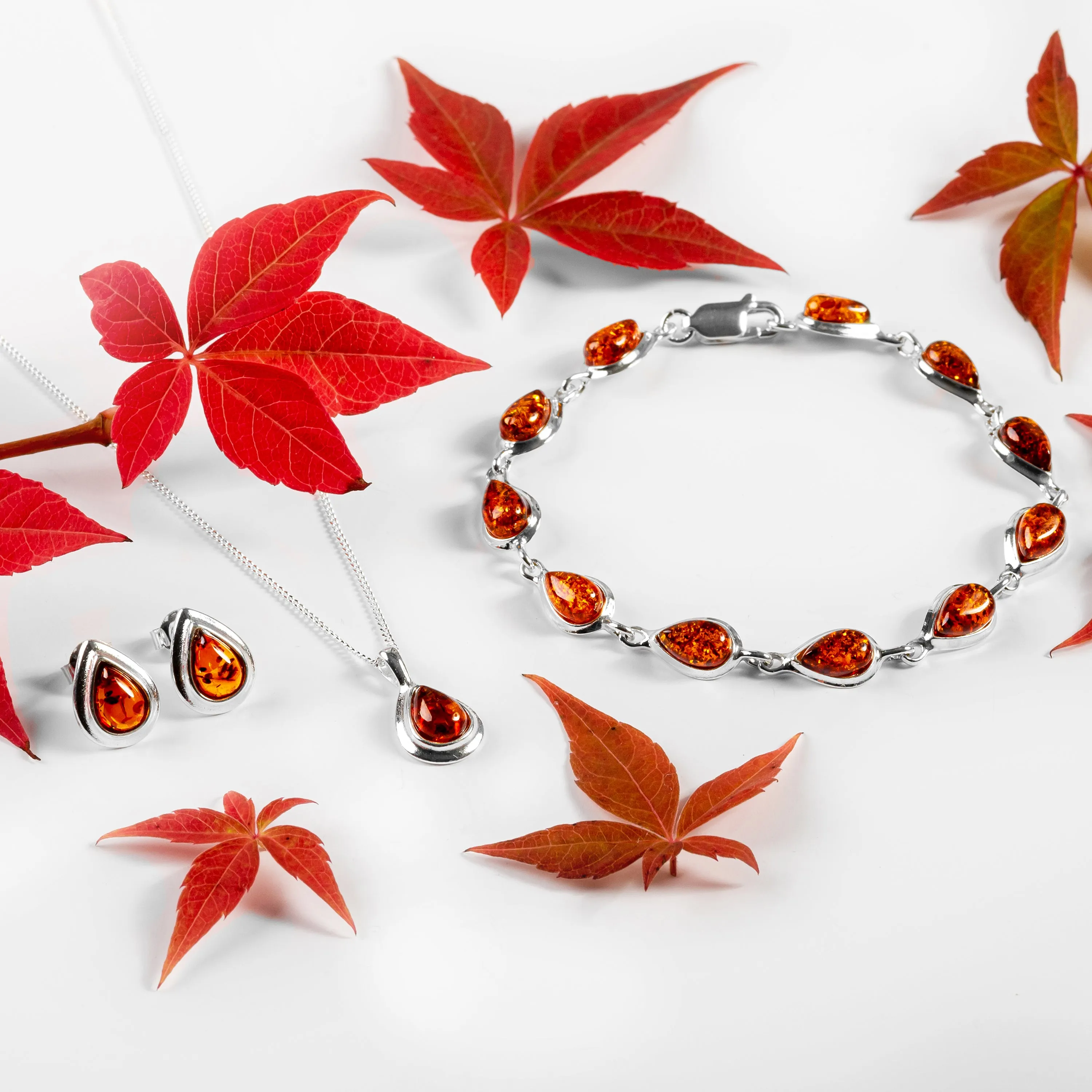 Classic Teardrop Stud Earrings in Silver and Cognac Amber sold by Henryka product image thumbnail 4