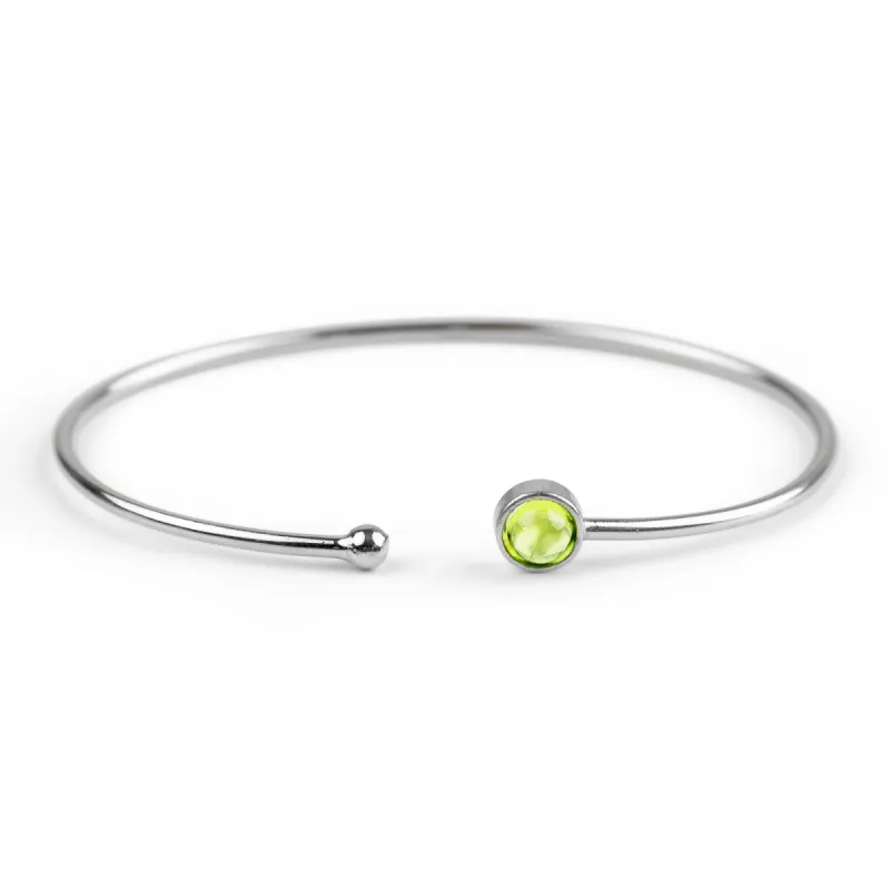 Simple Solo Cuff Bangle in Silver and Peridot sold by Henryka