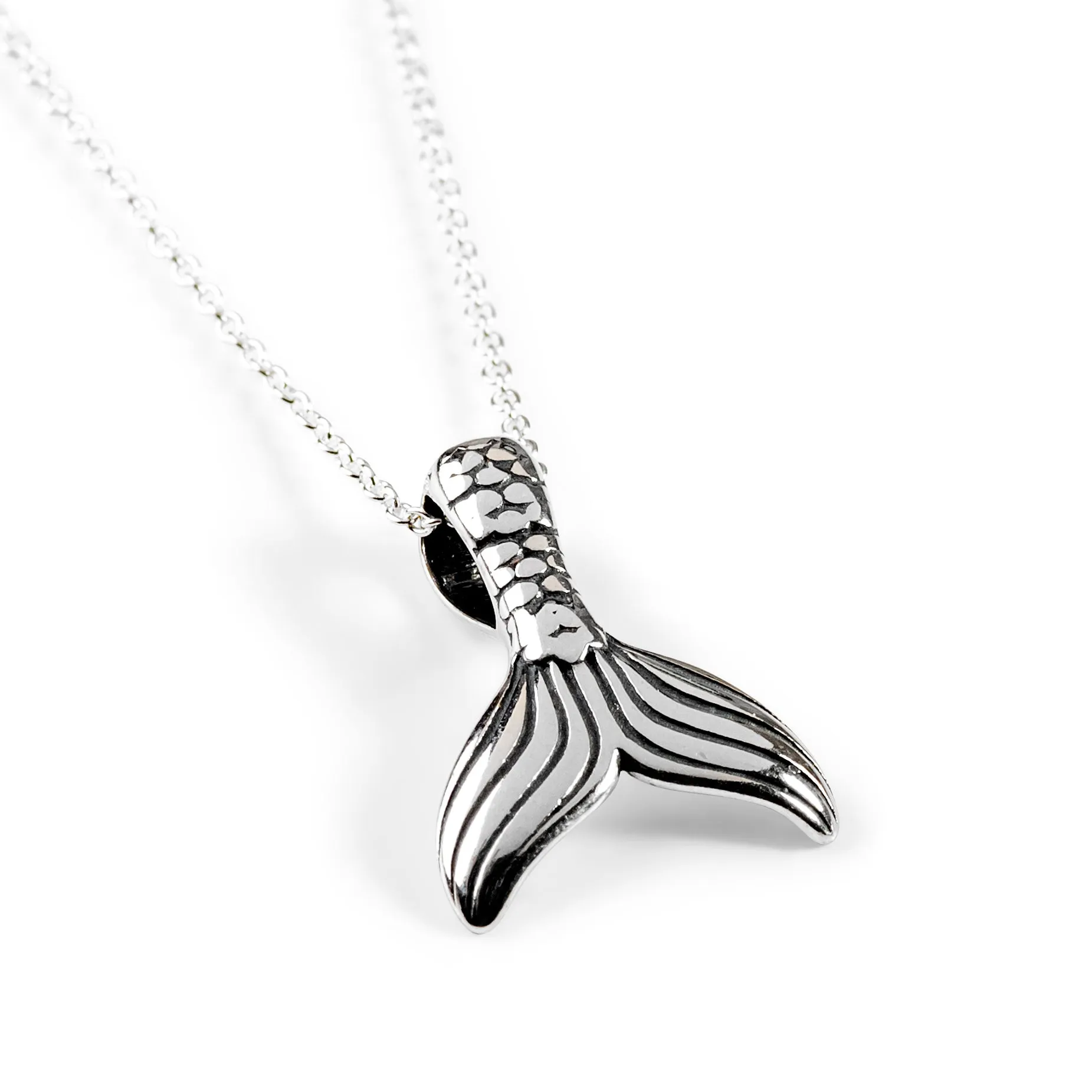 Small Mermaid Tail / Whale Necklace in Silver sold by Henryka