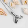 Small Mermaid Tail / Whale Necklace in Silver sold by Henryka