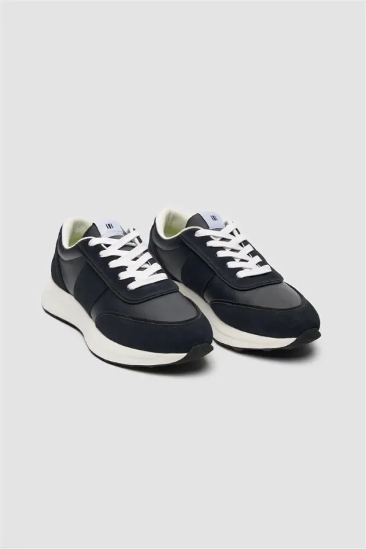 Alanza Navy Technical Runner sold by House of Cavani