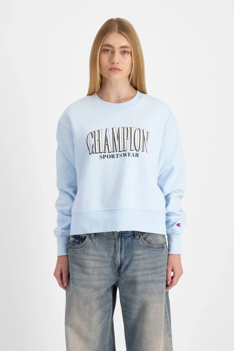 CHAMPION WOMEN'S GRAPHIC CREW BLUE SWEATSHIRT sold by INSPORT