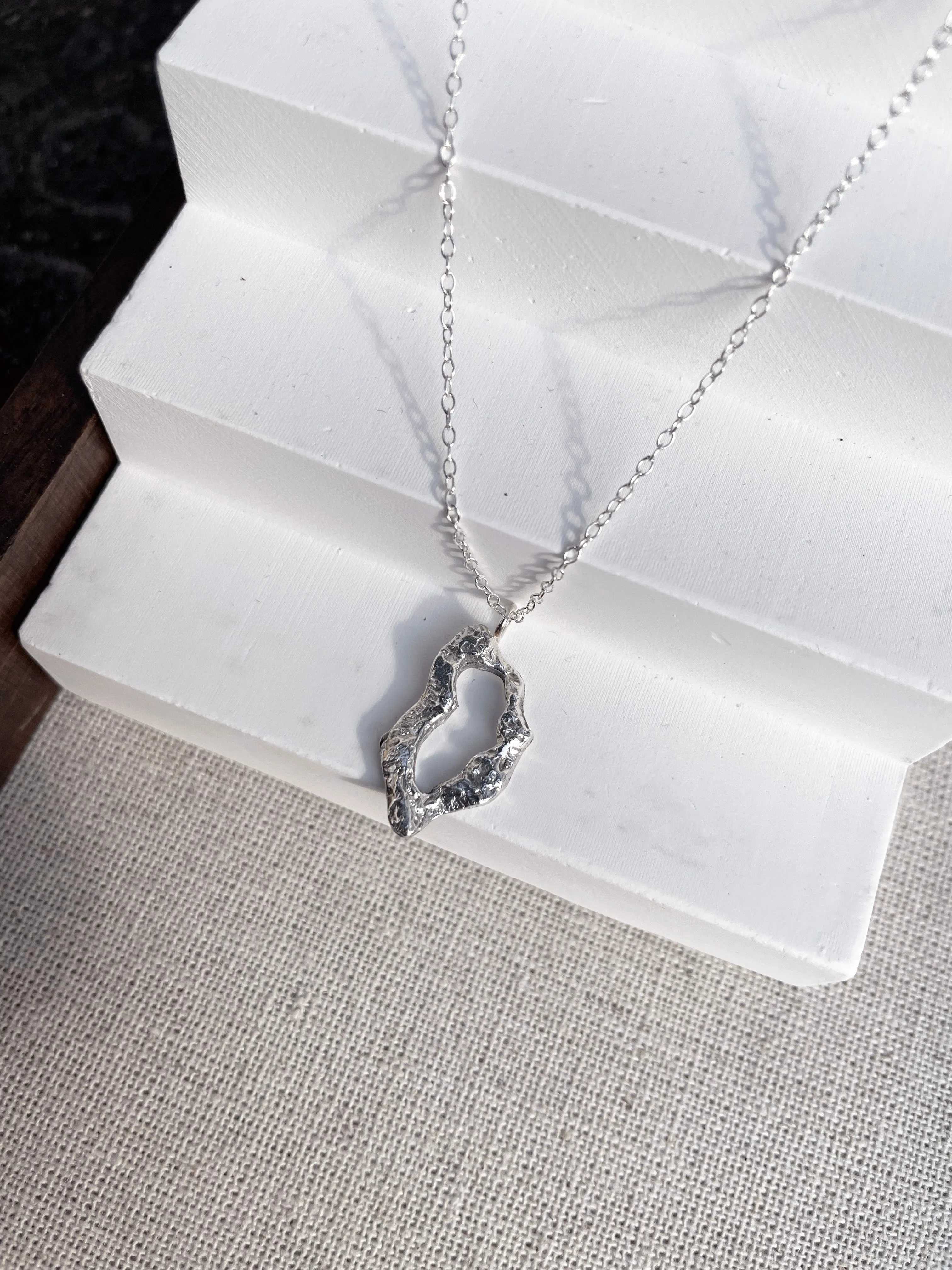 Maya Organic Shaped Oval Pendant Necklace Silver sold by Ivalo.com