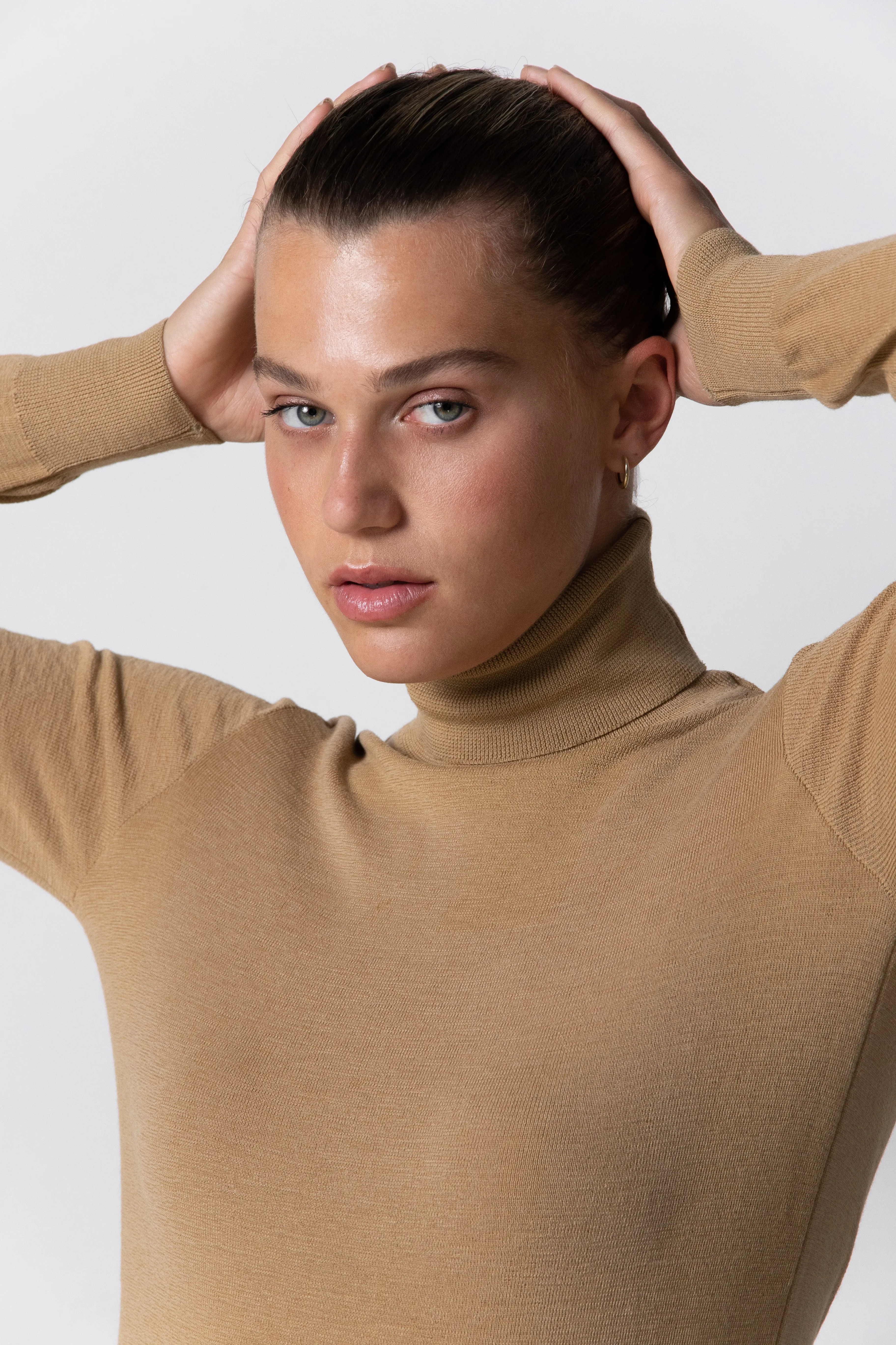 Merino Roll Neck Camel sold by Ivalo.com