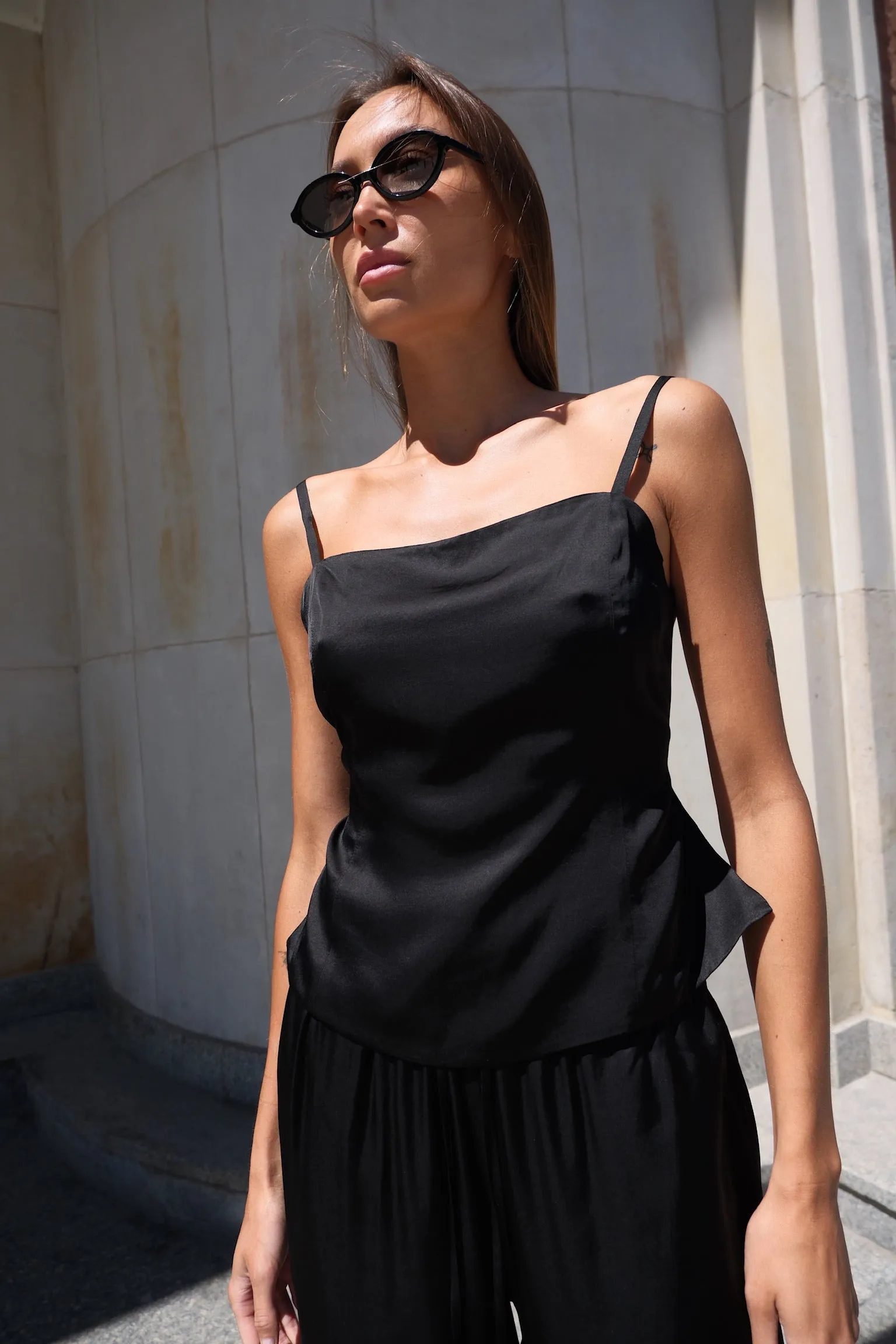 Satin top with back strap black sold by Ivalo.com