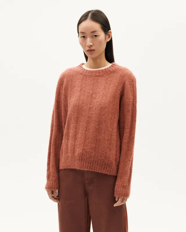 Red alpaca wool Layan sweater sold by Ivalo.com