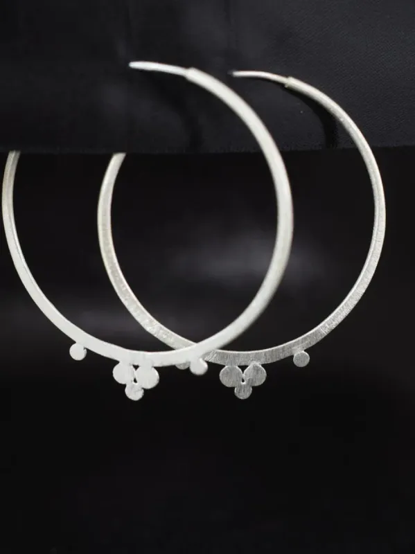 Brushed Silver Dot Hoops sold by Ivalo.com
