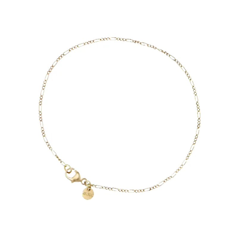 Figaro curb bracelet in 14 karat gold sold by Jane Koenig
