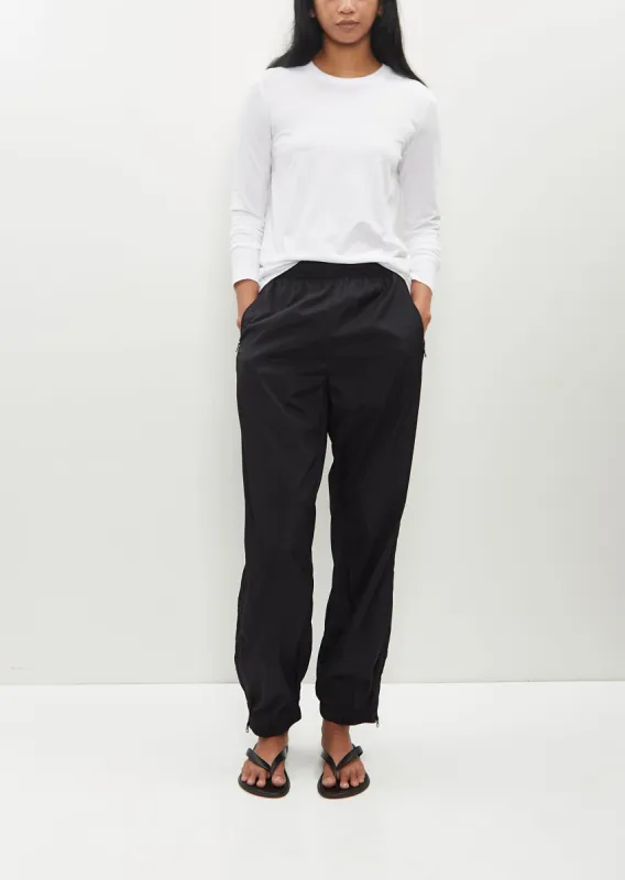 Packable Warm Up Pants sold by La Garconne