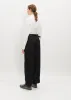 Double Tucked Mackin Wool Gabardine Pants — Black sold by La Garconne