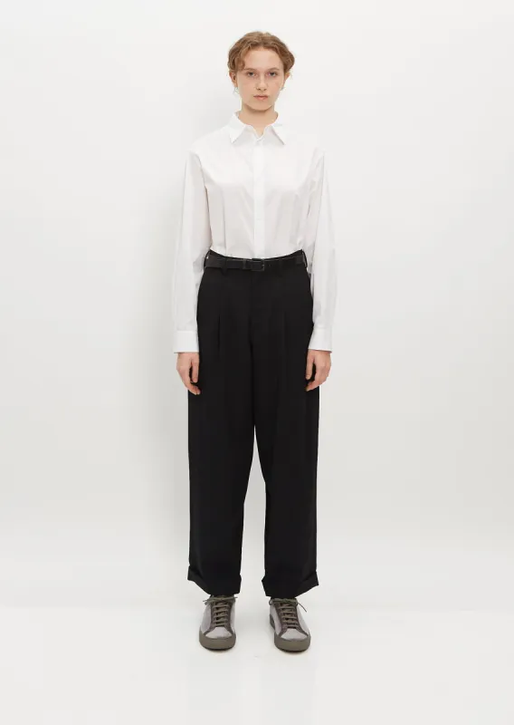 Double Tucked Mackin Wool Gabardine Pants — Black sold by La Garconne