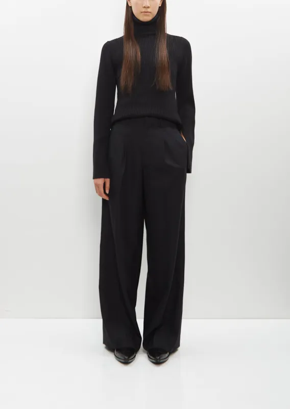 Pleated Pants sold by La Garconne