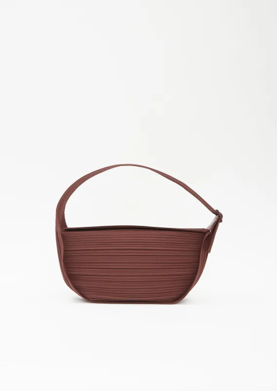 Pleats Half Moon Bag sold by La Garconne