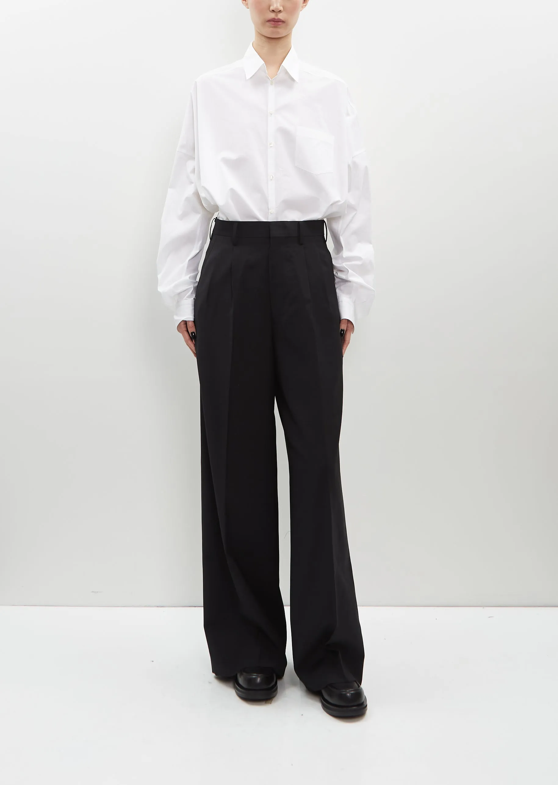 Tropical Wool Pleated Pants sold by La Garconne