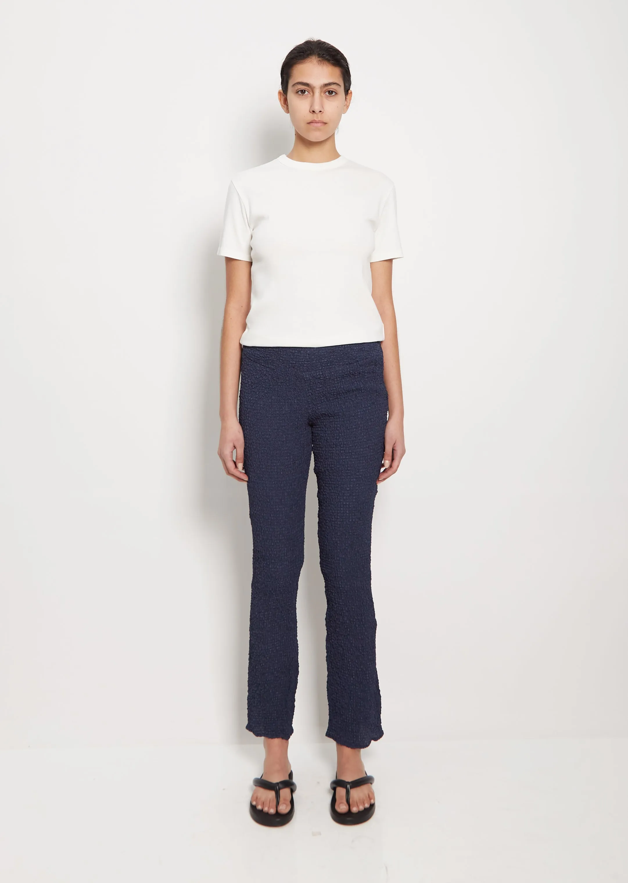 Cupro Check Flared Pants sold by La Garconne