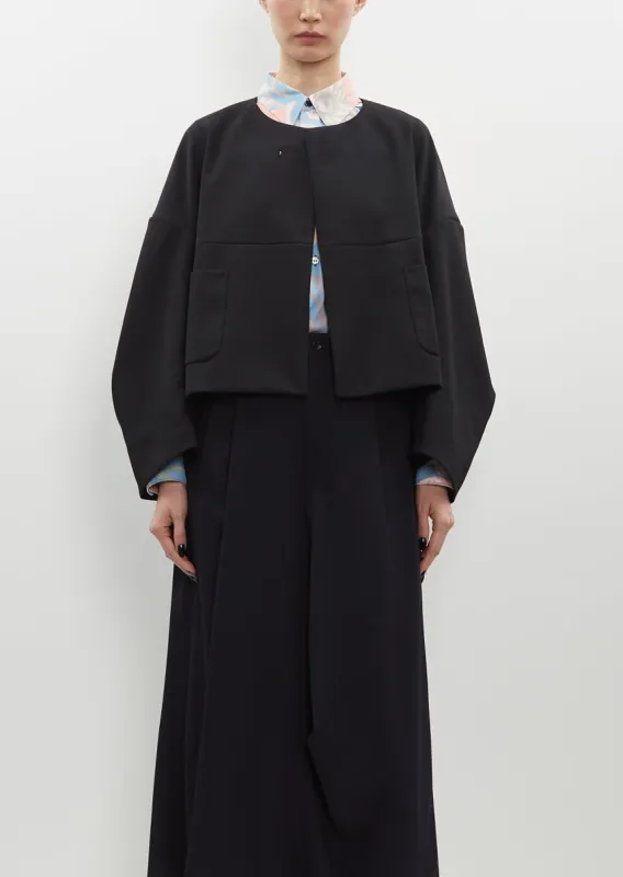 Collarless Wool Gabardine Jacket sold by La Garconne