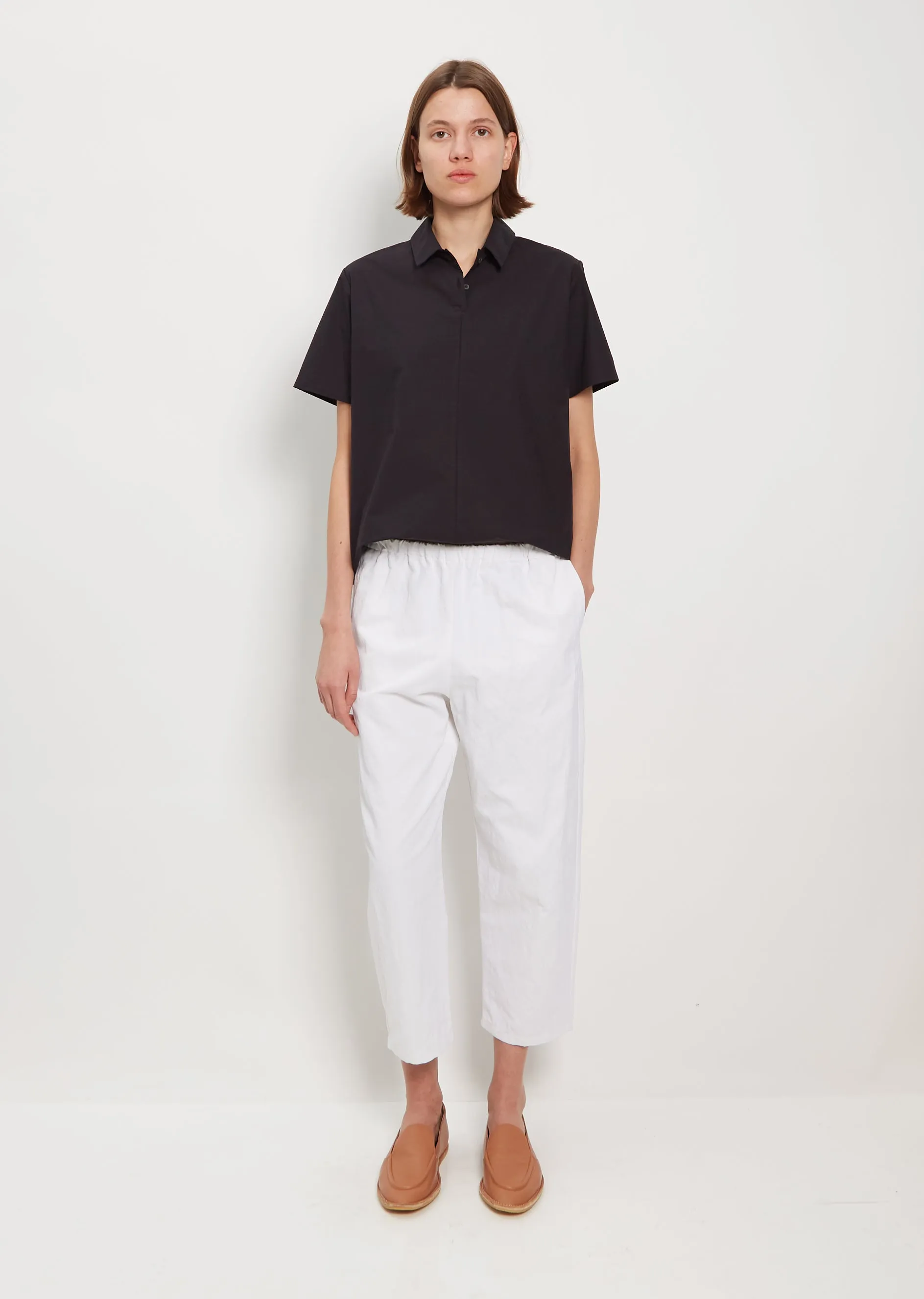 Tapered Pullon Trousers — White sold by La Garconne