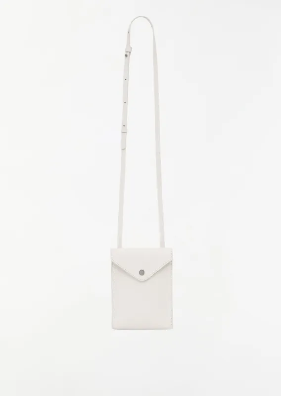 Envelope with Strap — Light Cream sold by La Garconne