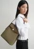 Belted Bucket Bag sold by La Garconne