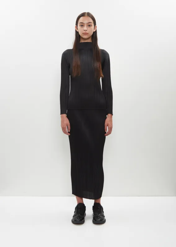Basics Pleated Straight Skirt sold by La Garconne