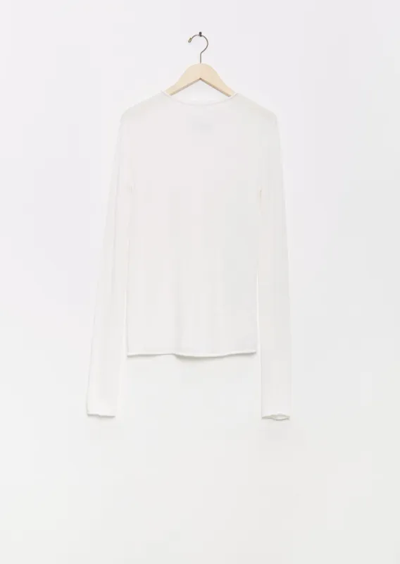 Super Fine Alpaca Rollneck — White sold by La Garconne