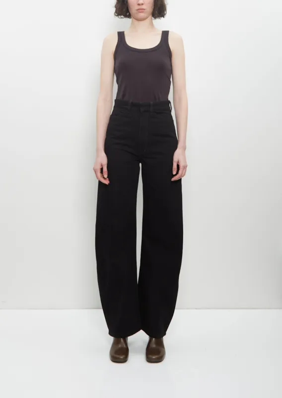 Denim High Waisted Curved Pants — Black sold by La Garconne