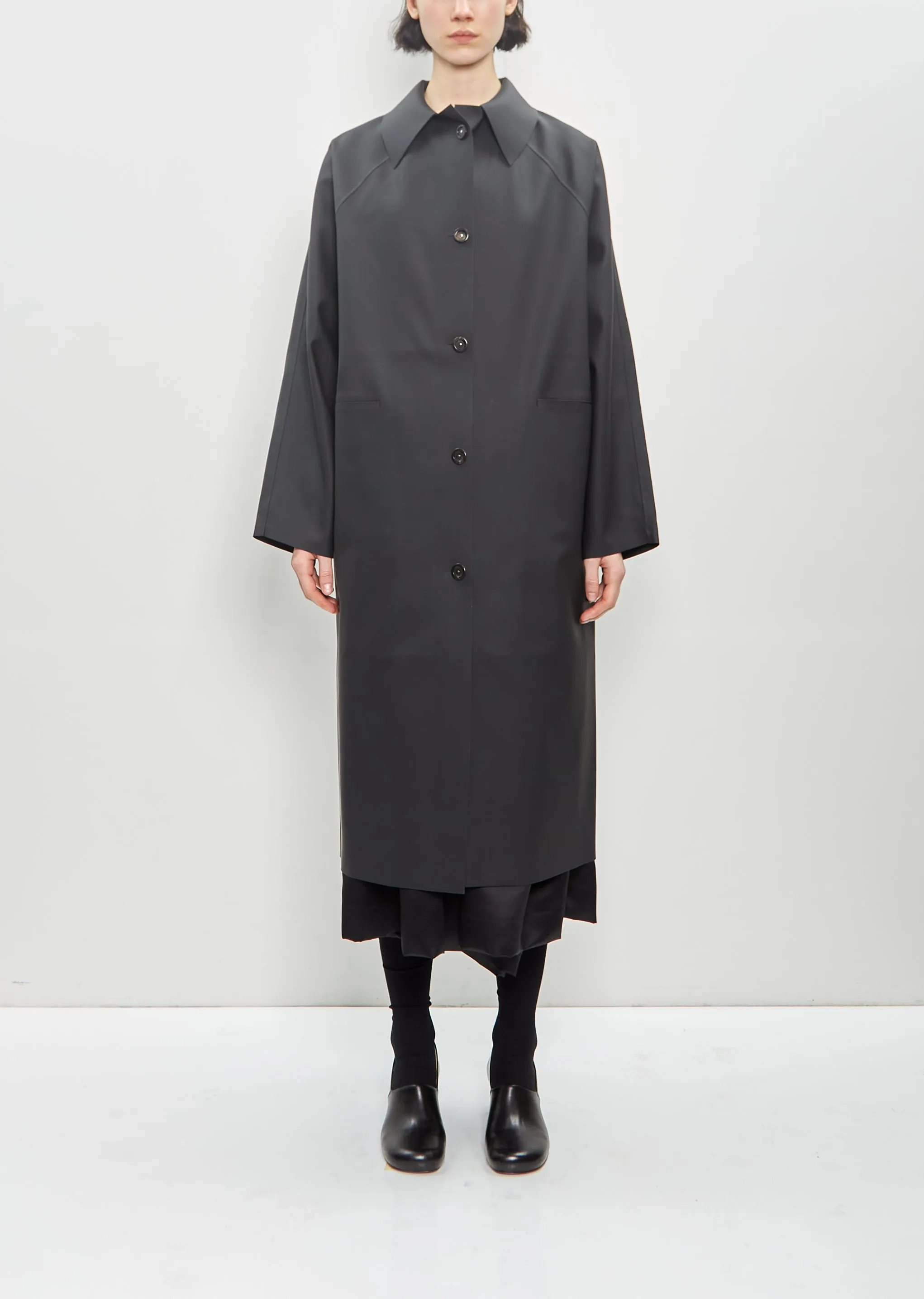 Rubber Original Below Coat — Black sold by La Garconne
