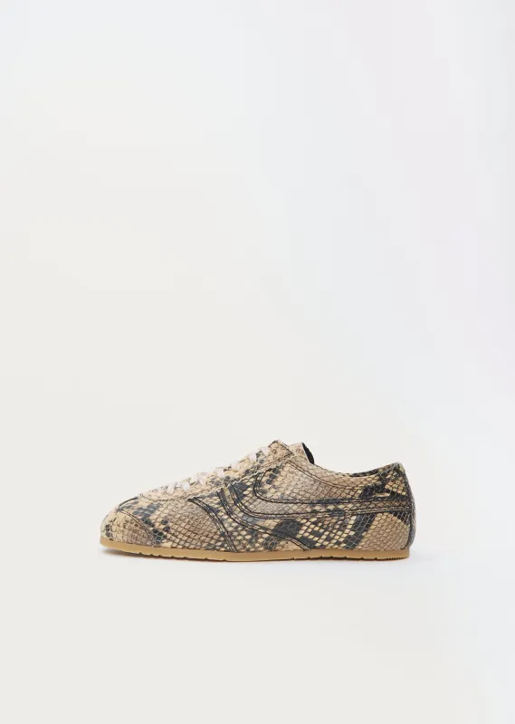 Snake Effect Leather Trainer sold by La Garconne