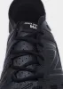 New Balance Minimus UX200L — Black sold by La Garconne