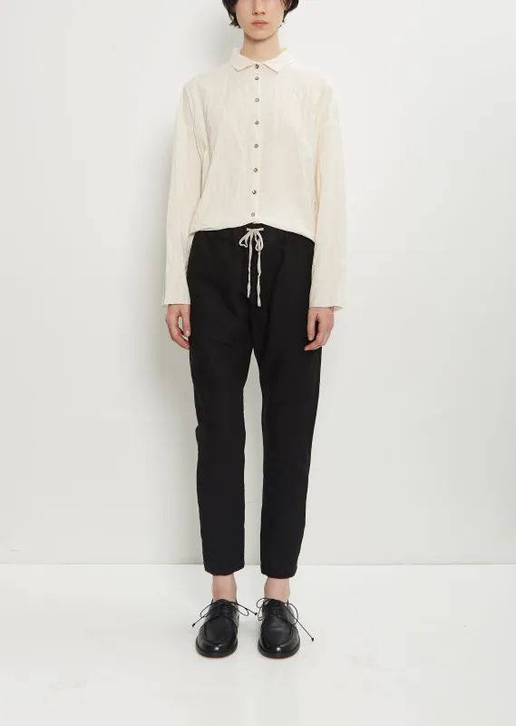 Stretch Wool Cotton Slim Trousers sold by La Garconne