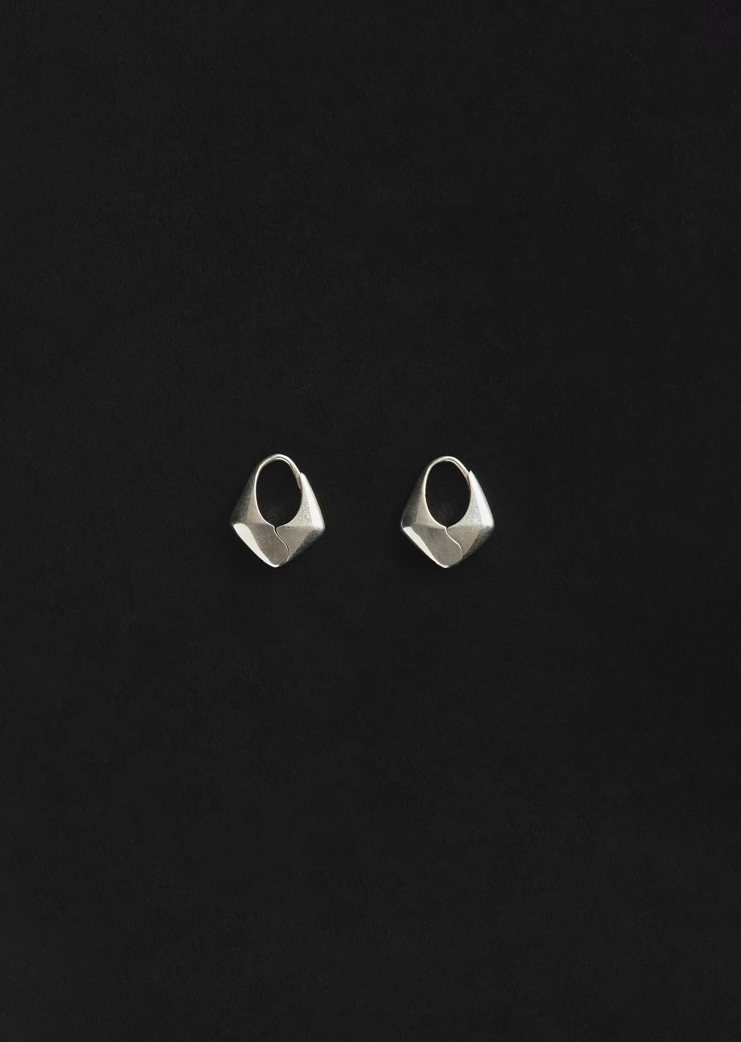 Small Silver Pyramid Hoops sold by La Garconne