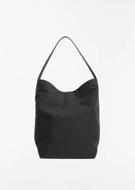 Large Canvas N/S Tote — Black sold by La Garconne