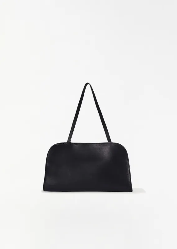 Peggy Saddle Leather Clutch — Black sold by La Garconne