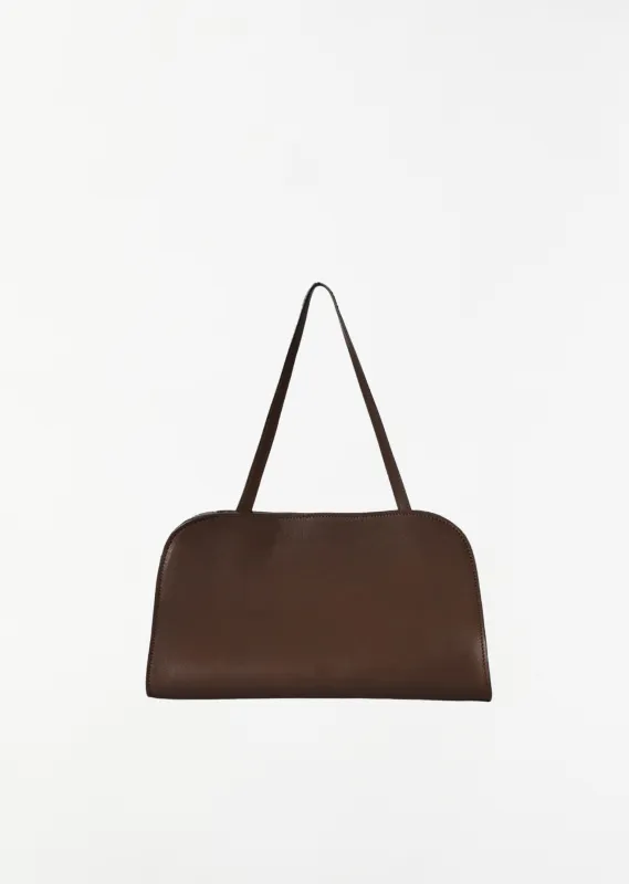Peggy Saddle Leather Clutch — Deep Brown sold by La Garconne
