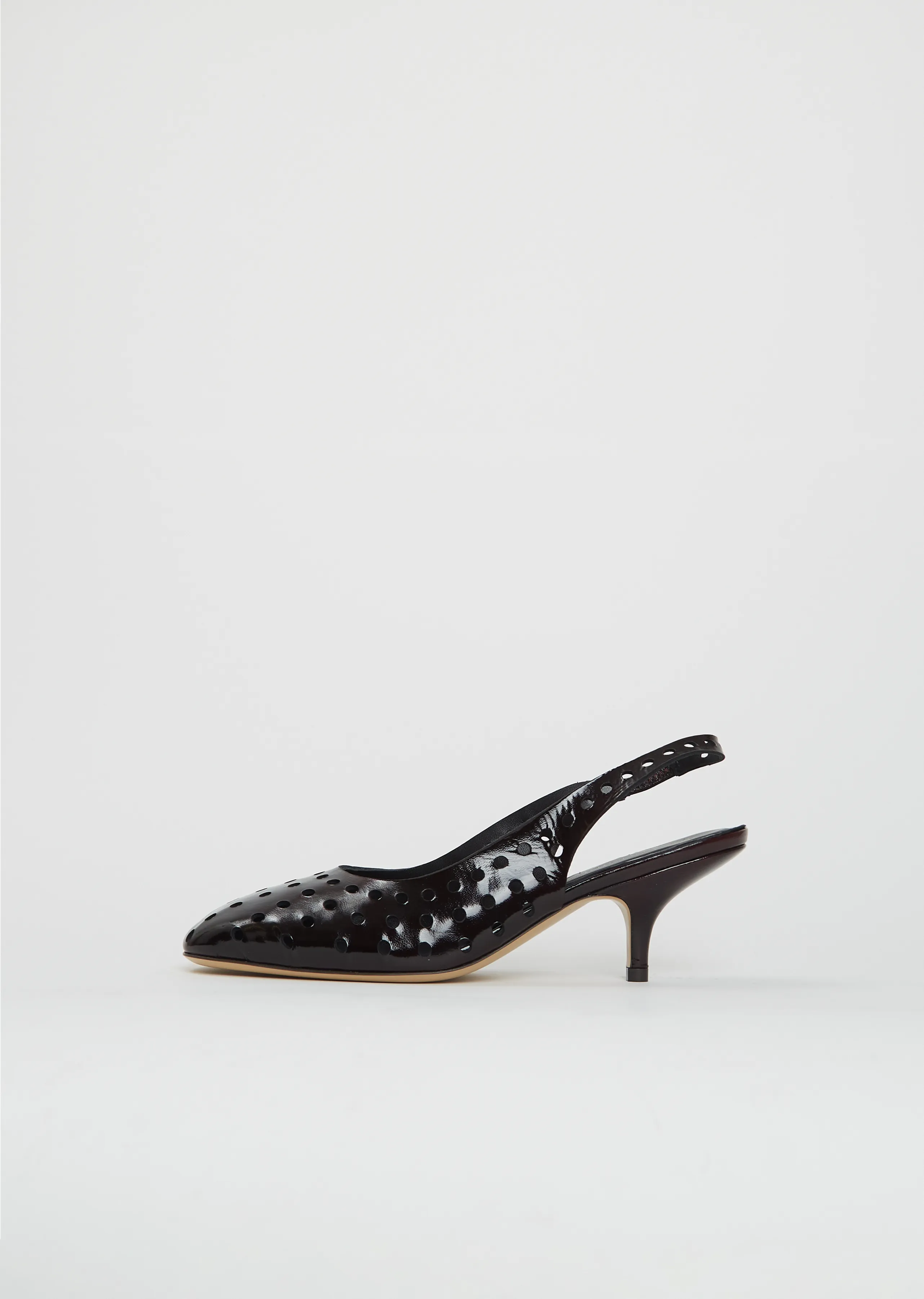 Perforated Leather Slingback Heels sold by La Garconne