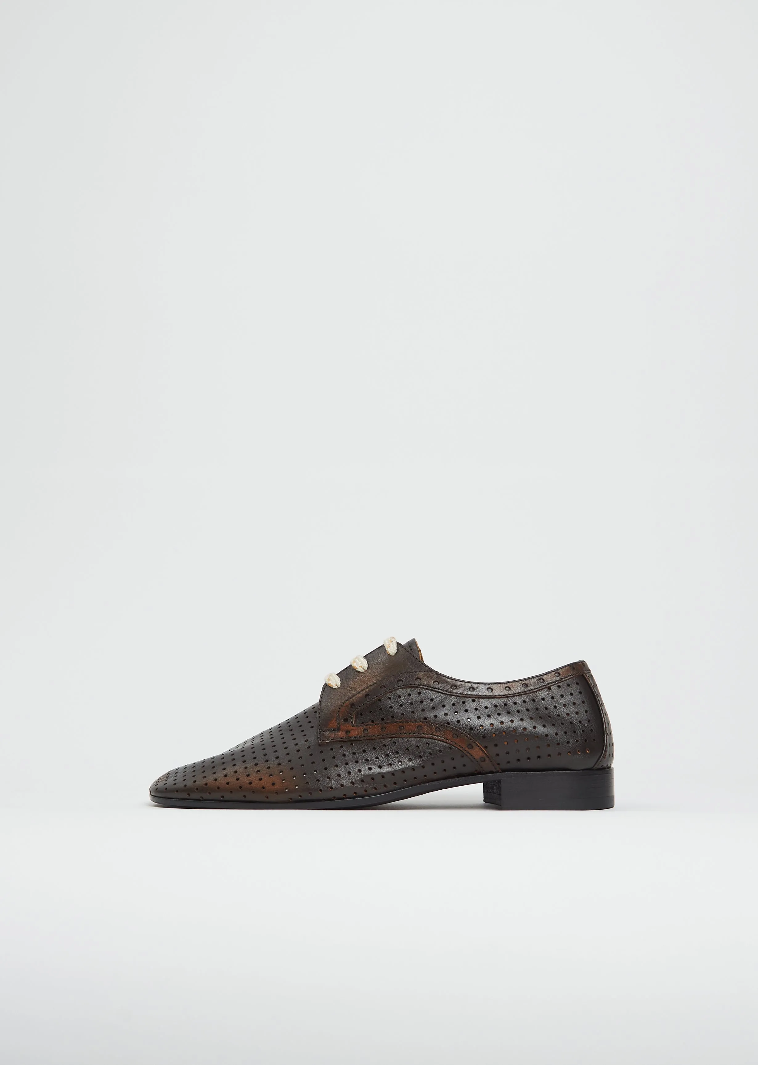 Perforated Oxford sold by La Garconne