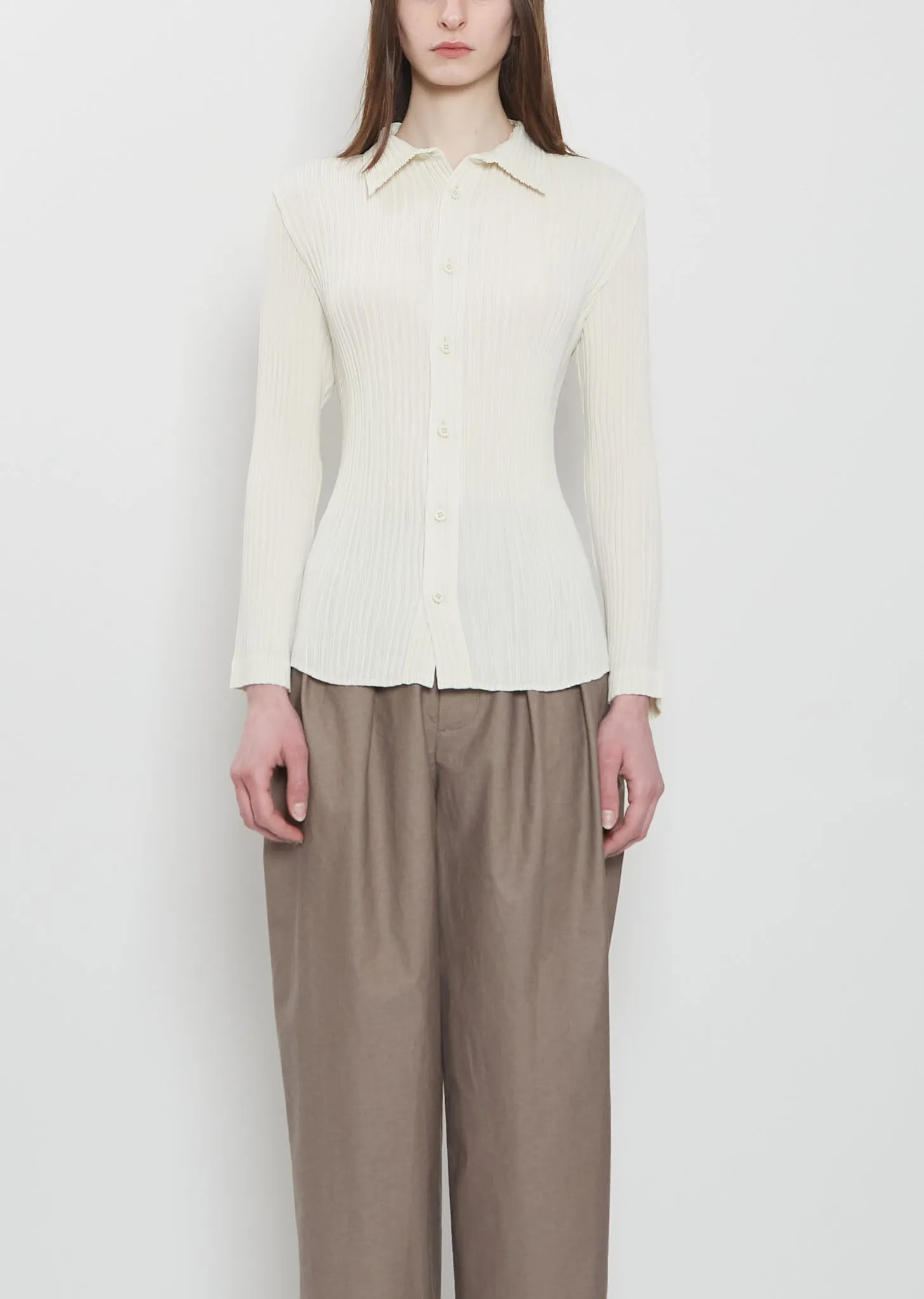 Hatching Pleats Polo sold by La Garconne