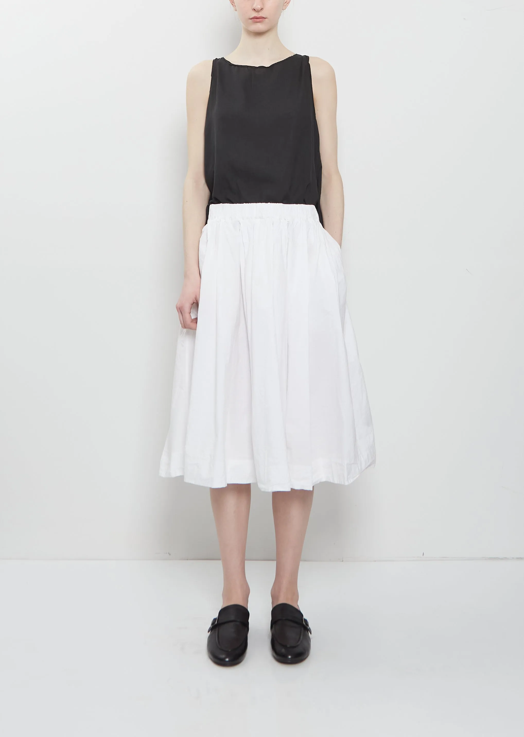 Ultra Light Canvas Pleated Skirt — White sold by La Garconne