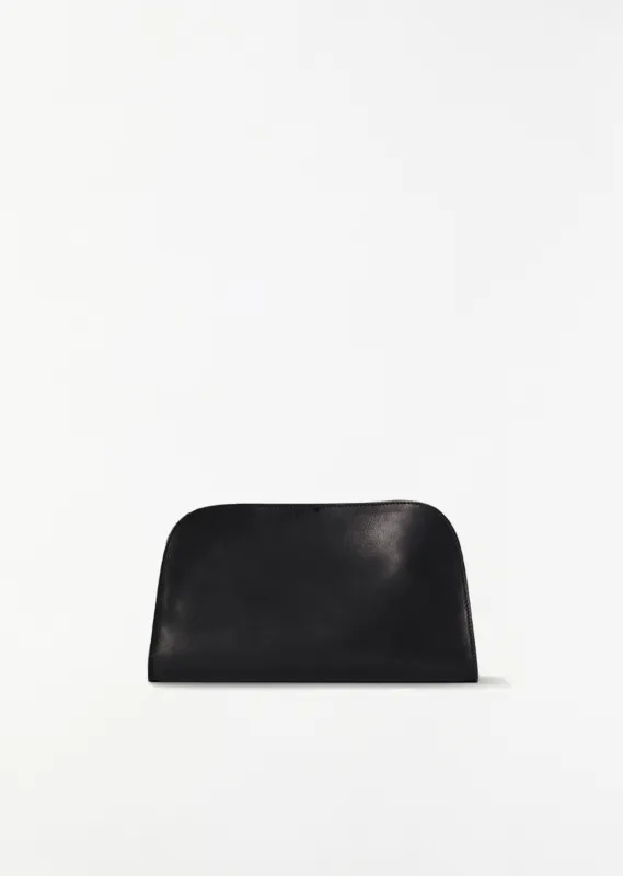 Peggy Saddle Leather Clutch — Black made by The Row