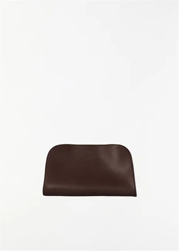 Peggy Saddle Leather Clutch — Burgundy made by The Row