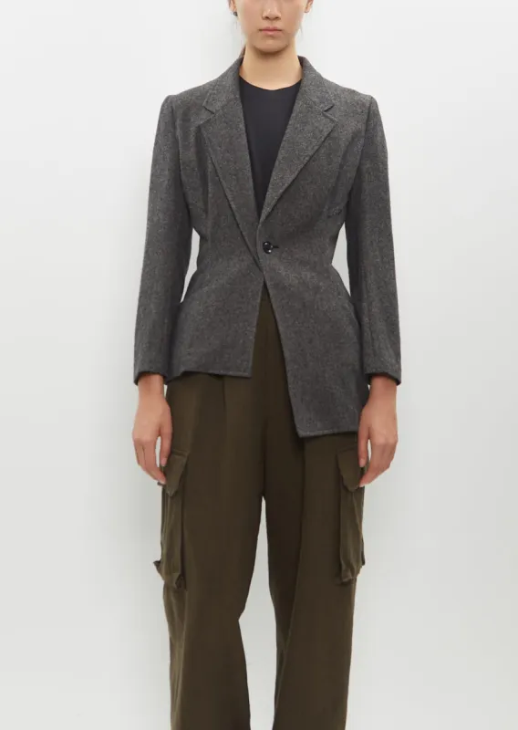 Asymmetry Jacket sold by La Garconne