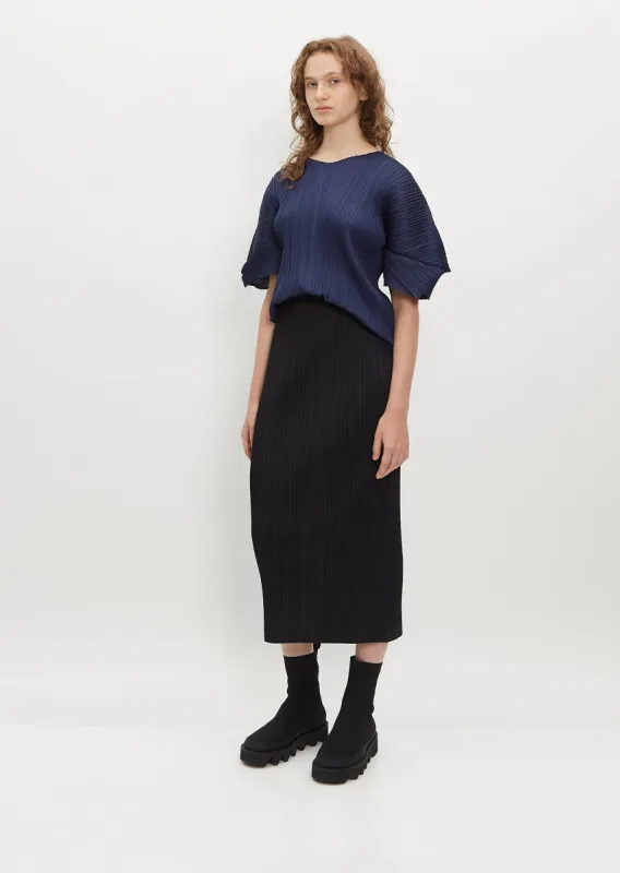 Pleated Straight Skirt sold by La Garconne