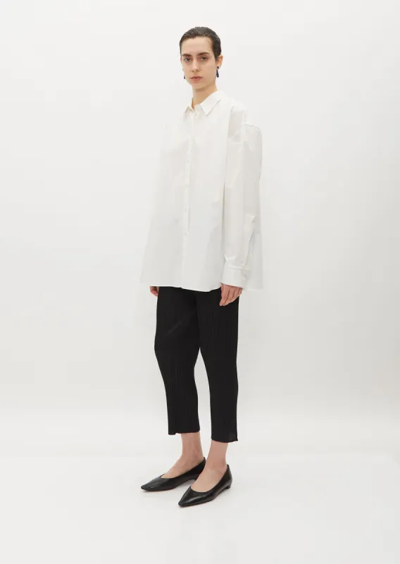 Pleated Crop Tapered Pants — Black sold by La Garconne